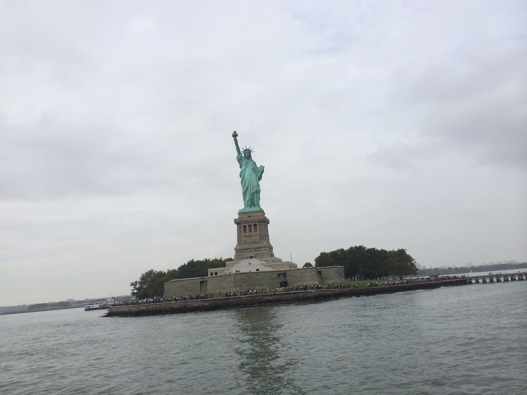 Tourists looking at the Statue of Liberty