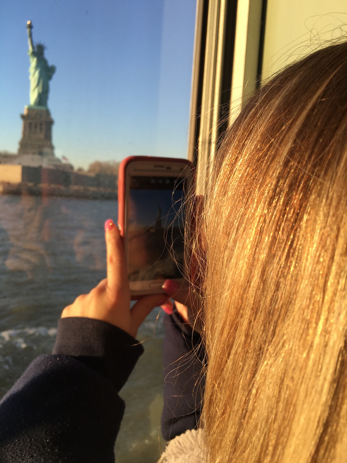 Taking a picture of the Statue of Liberty