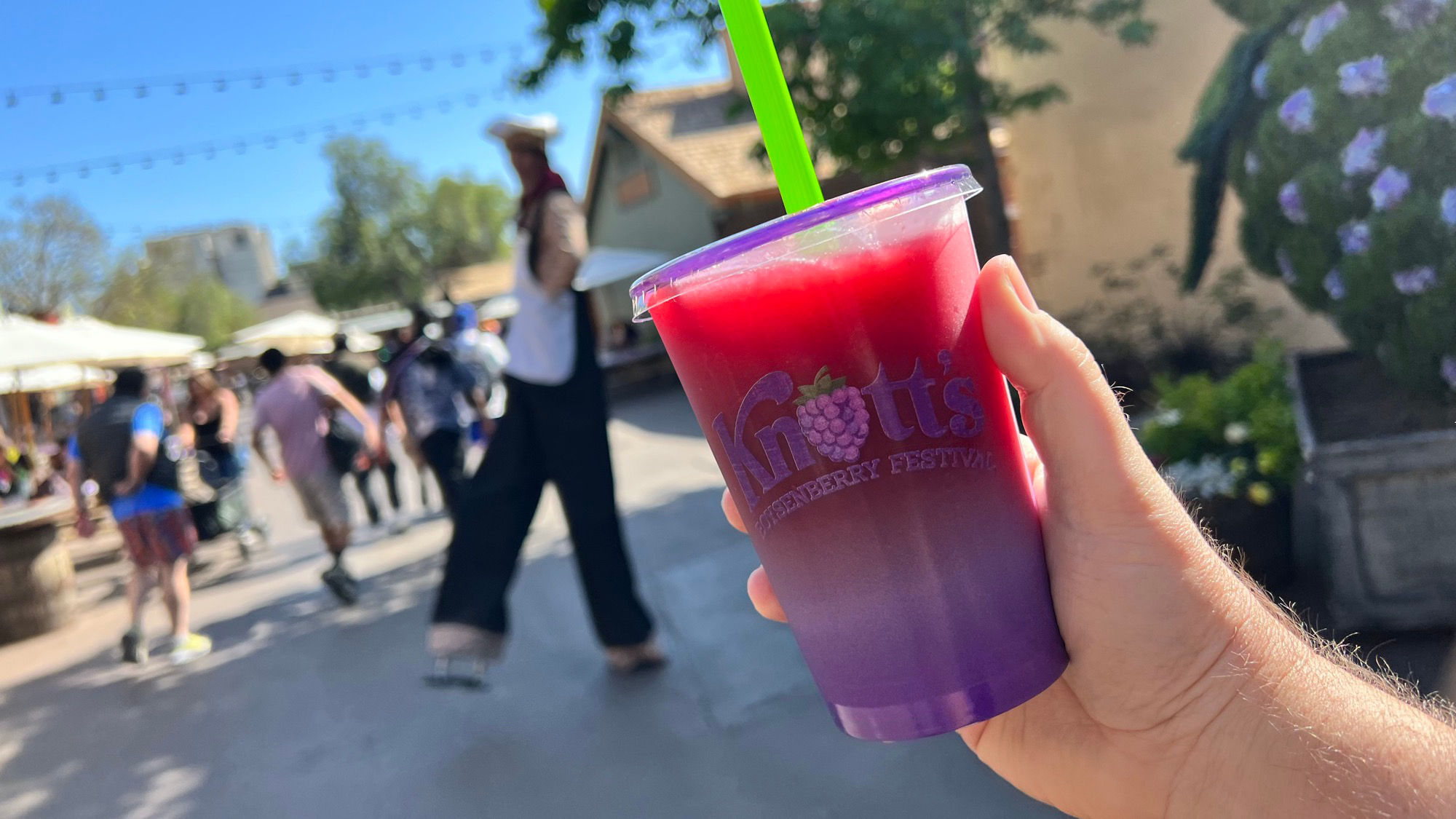 Boysenberry & Pomegranate Smoothie Man on Stilts Walking By