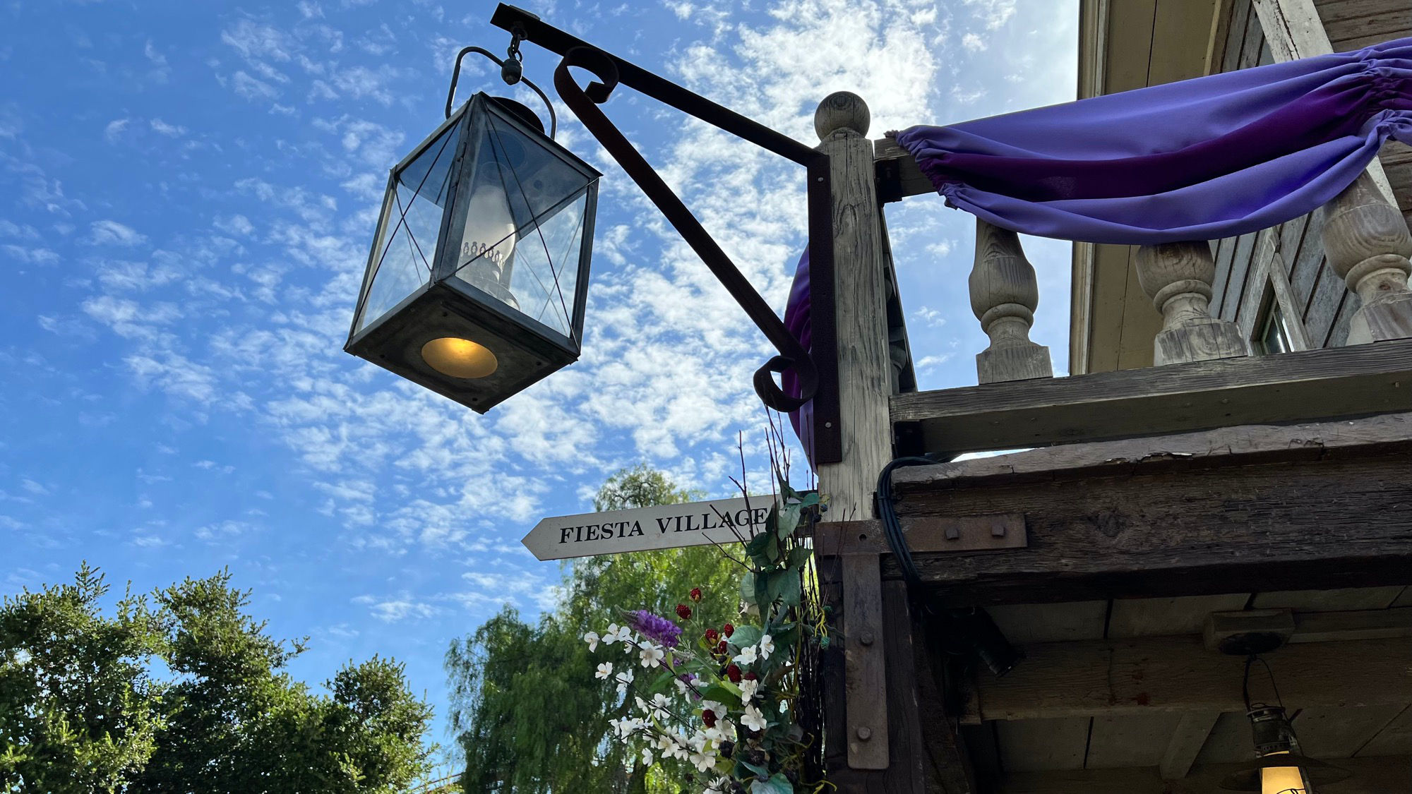 Calico Saloon pointing at Fiesta Village Lamp Post Calico Saloon pointing at Fiesta Village