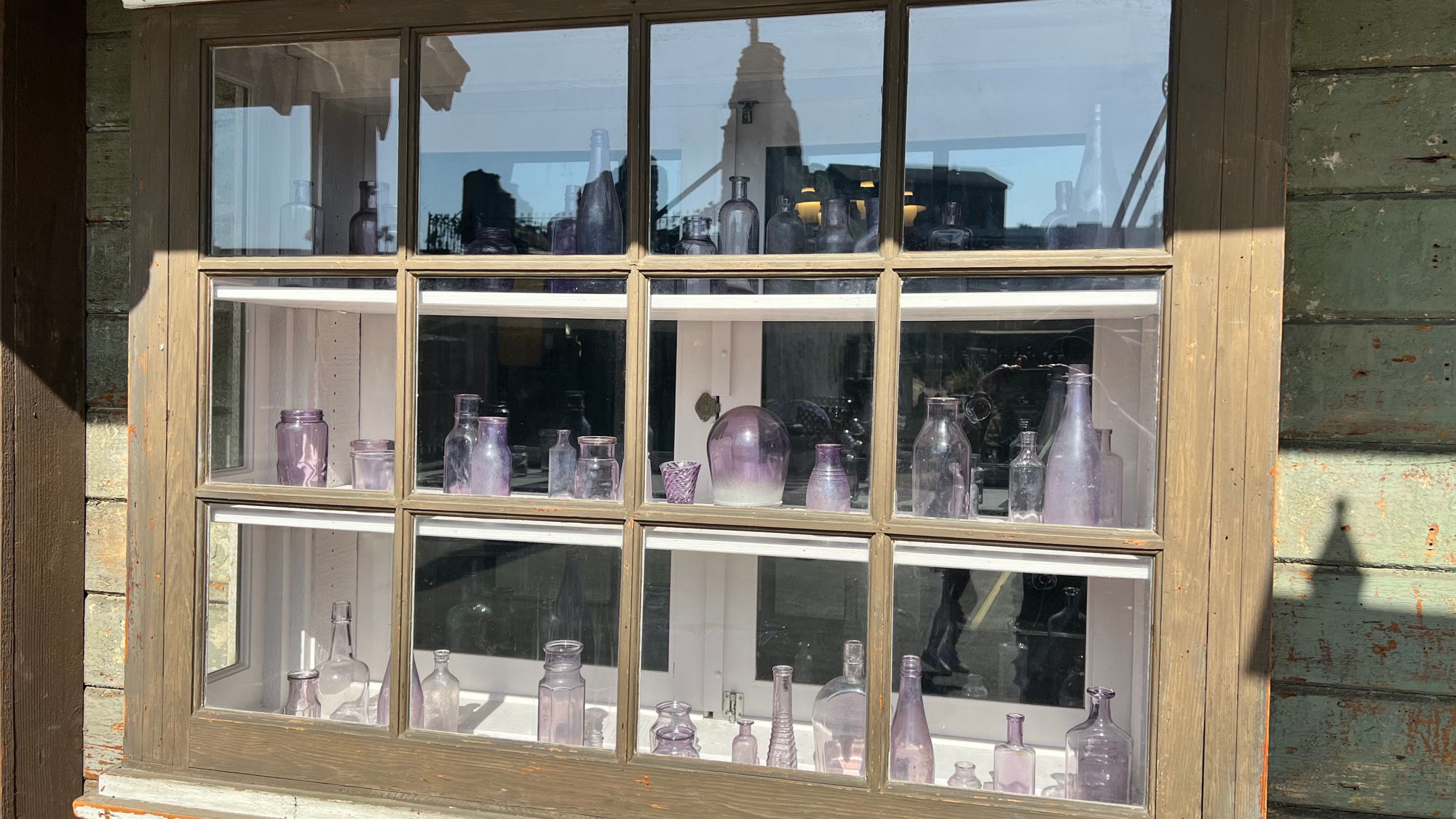 Vintage Purple Bottles Window Display