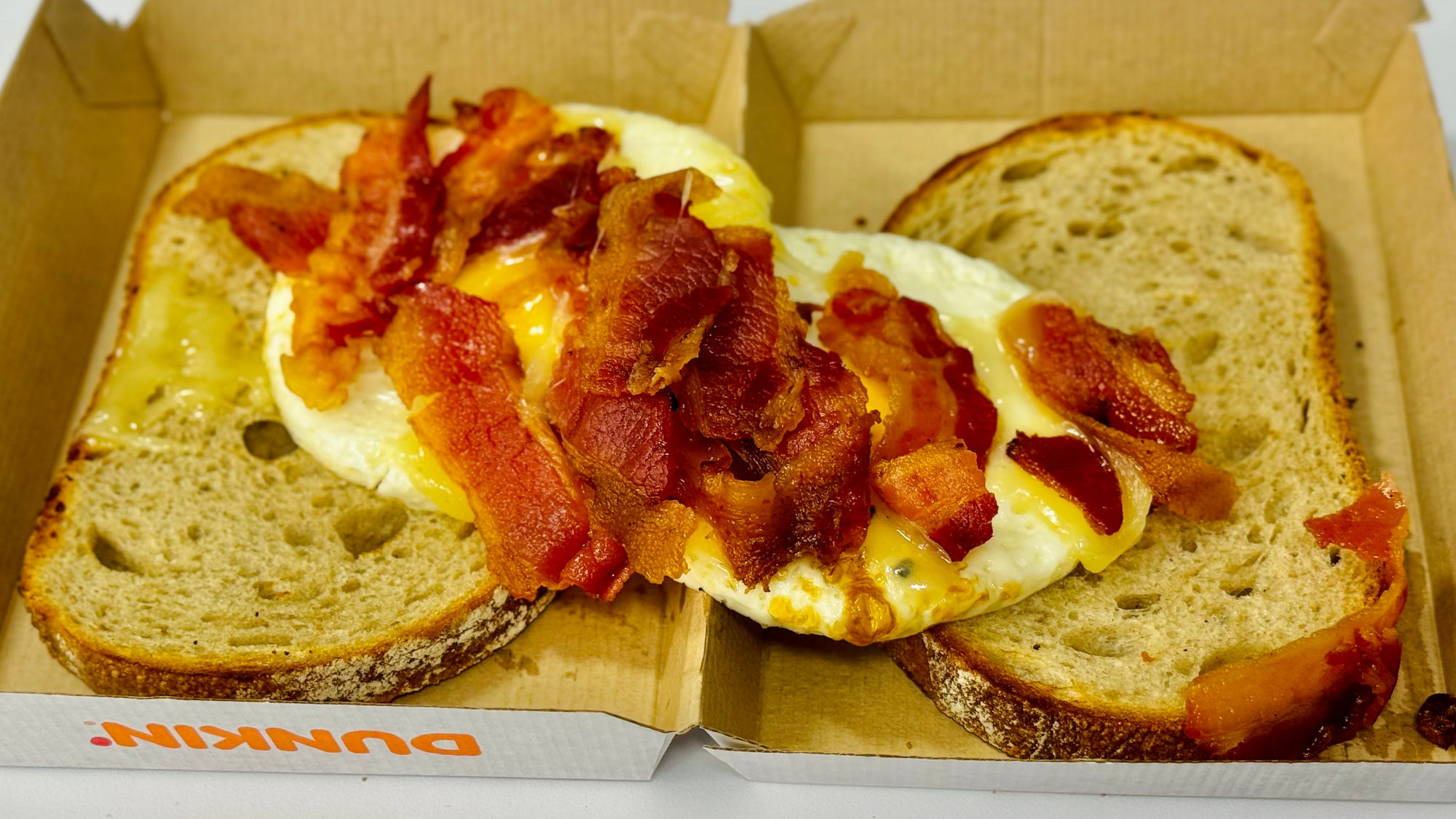 Dunkin' Maple Sugar Bacon Sourdough Breakfast Sandwich